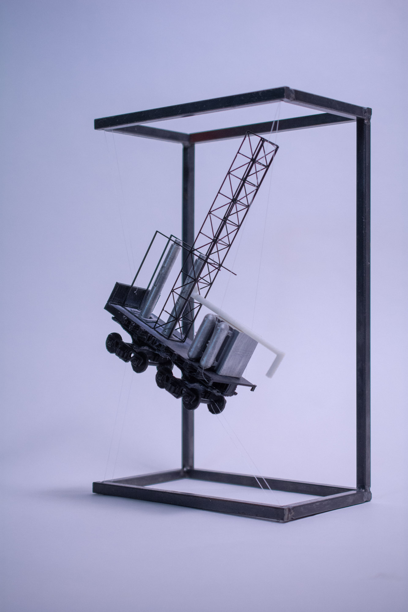 Fragment model — jet boring system in steel display frame
